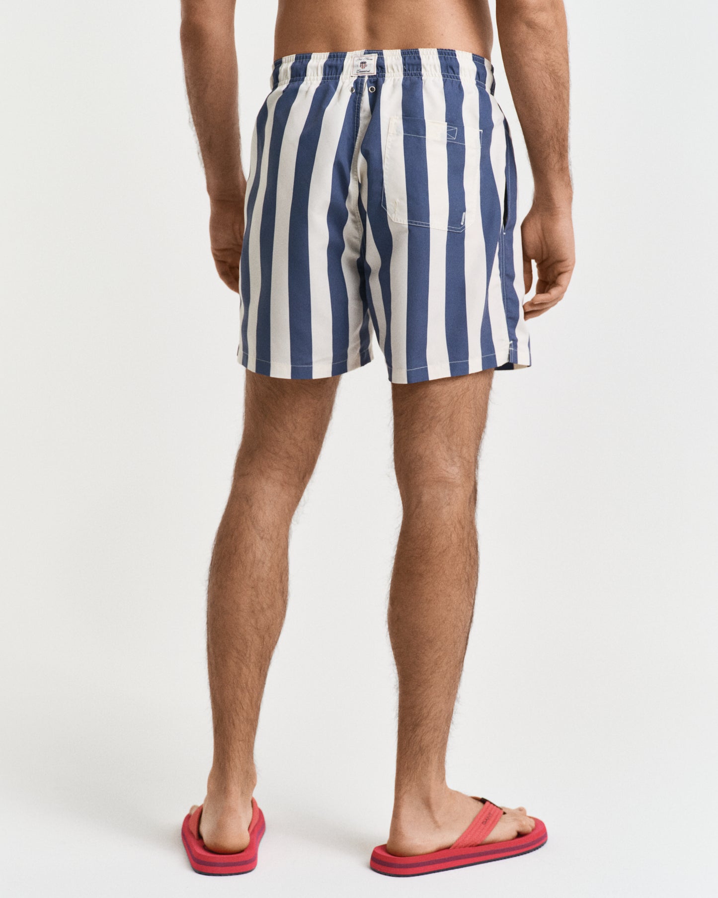 DUSTY NAVY, BLOCK STRIPE SWIM SHORTS, BACK-VIEW BY GANT AU.