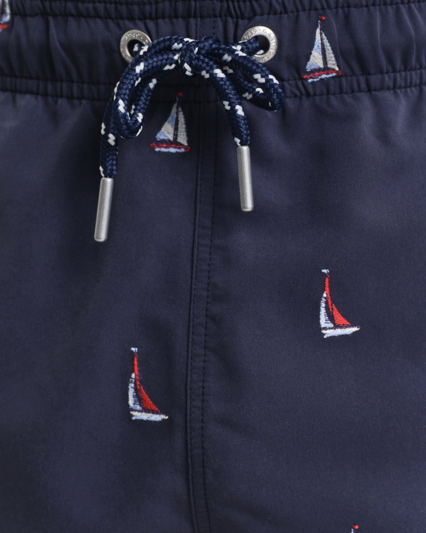 MODEL WEARING BOAT EMBROIDERY SWIM SHORTS