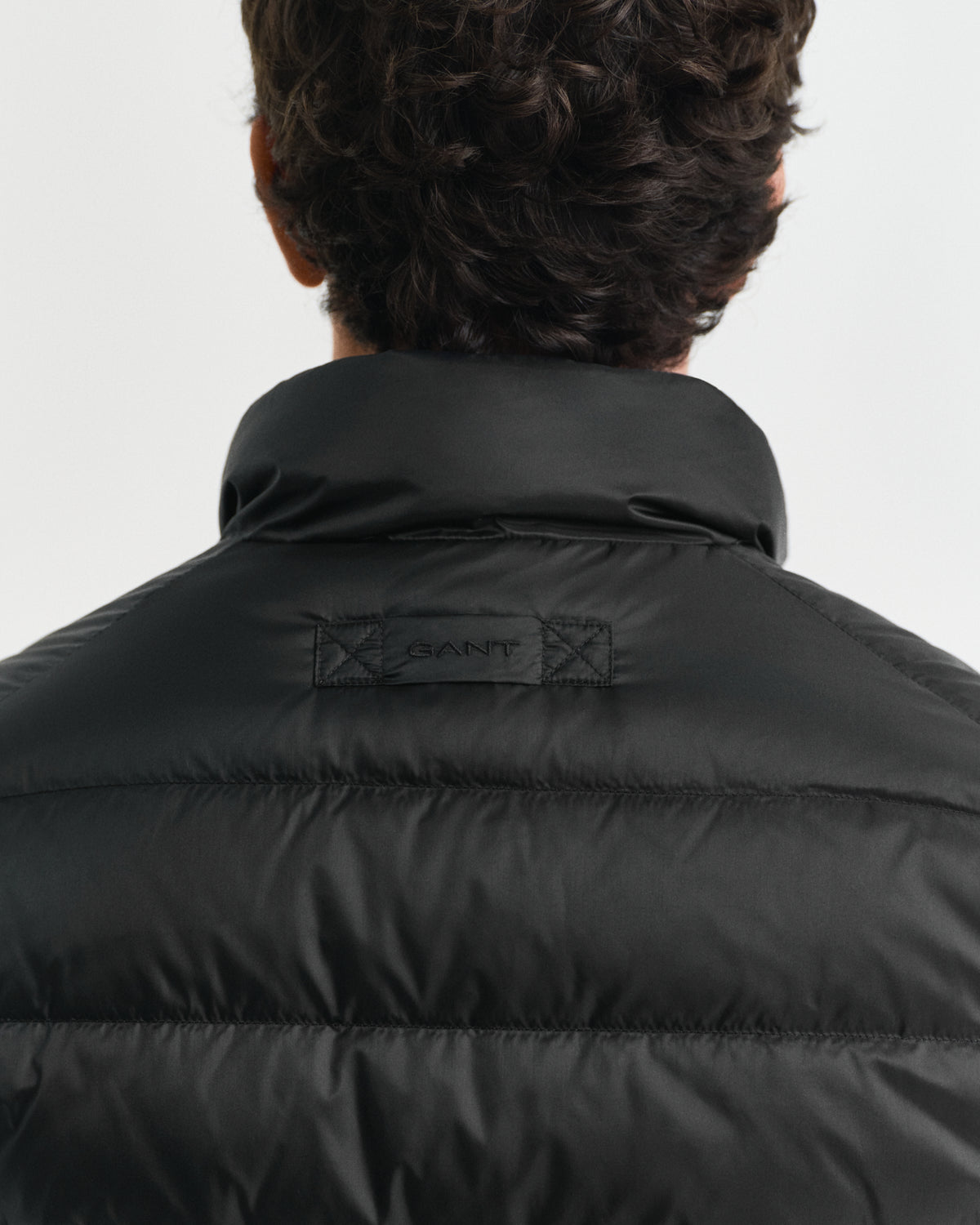 MODEL WEARING LIGHT DOWN JACKET