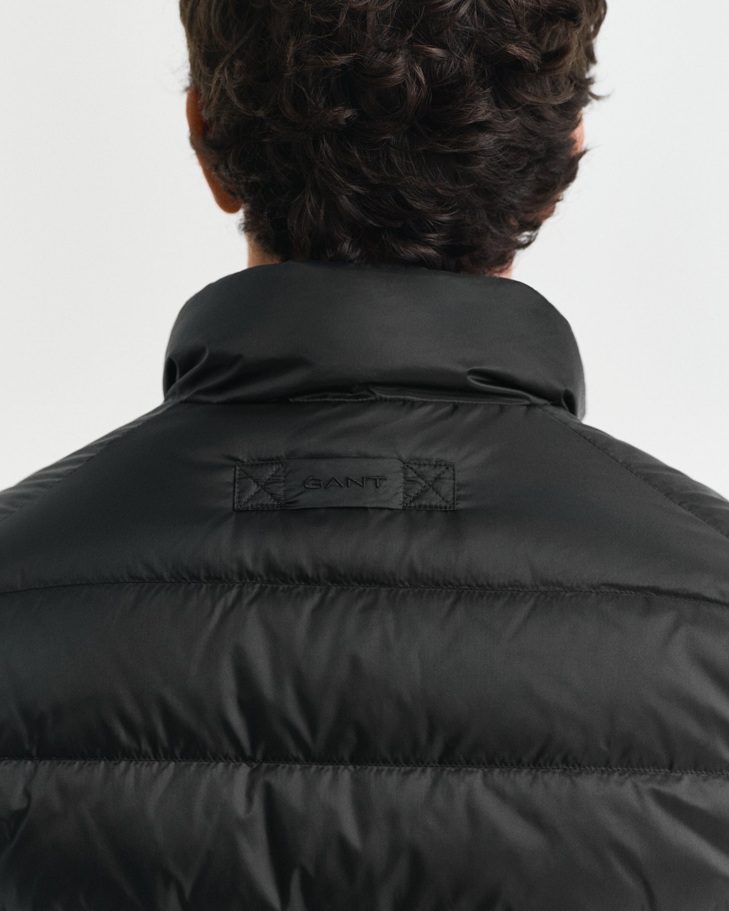 MODEL WEARING LIGHT DOWN JACKET