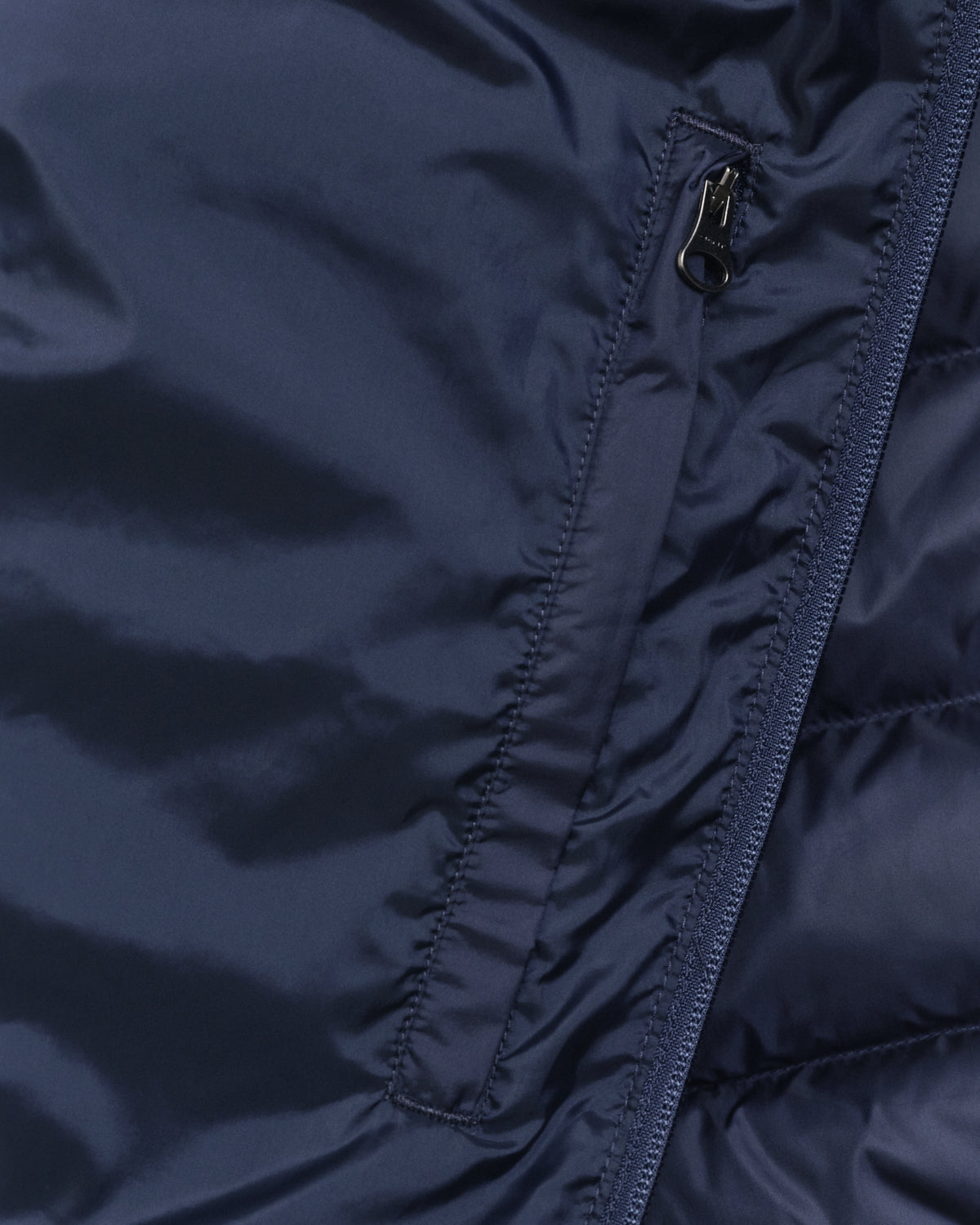 MODEL WEARING LIGHT DOWN JACKET