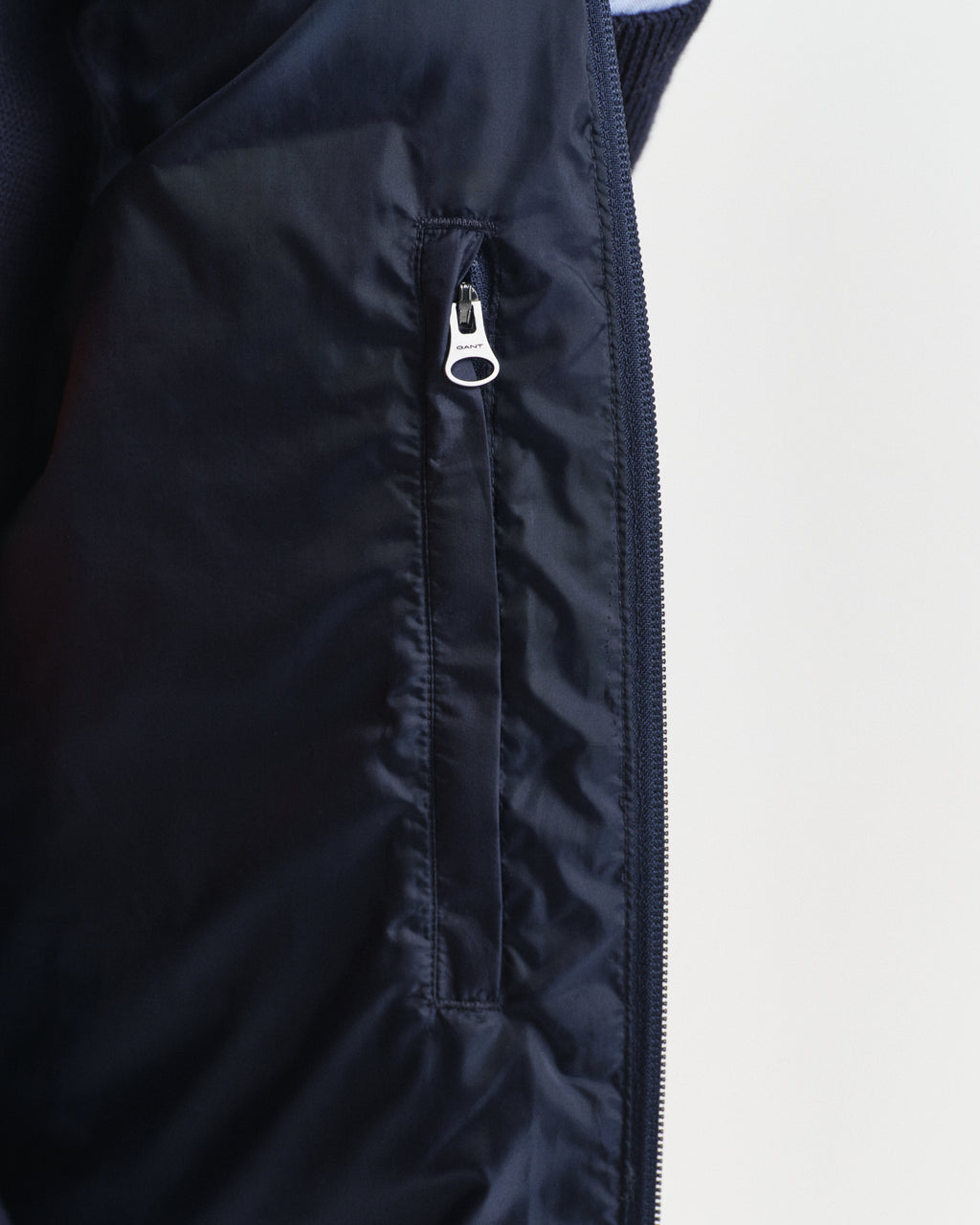 MODEL WEARING LIGHT DOWN VEST