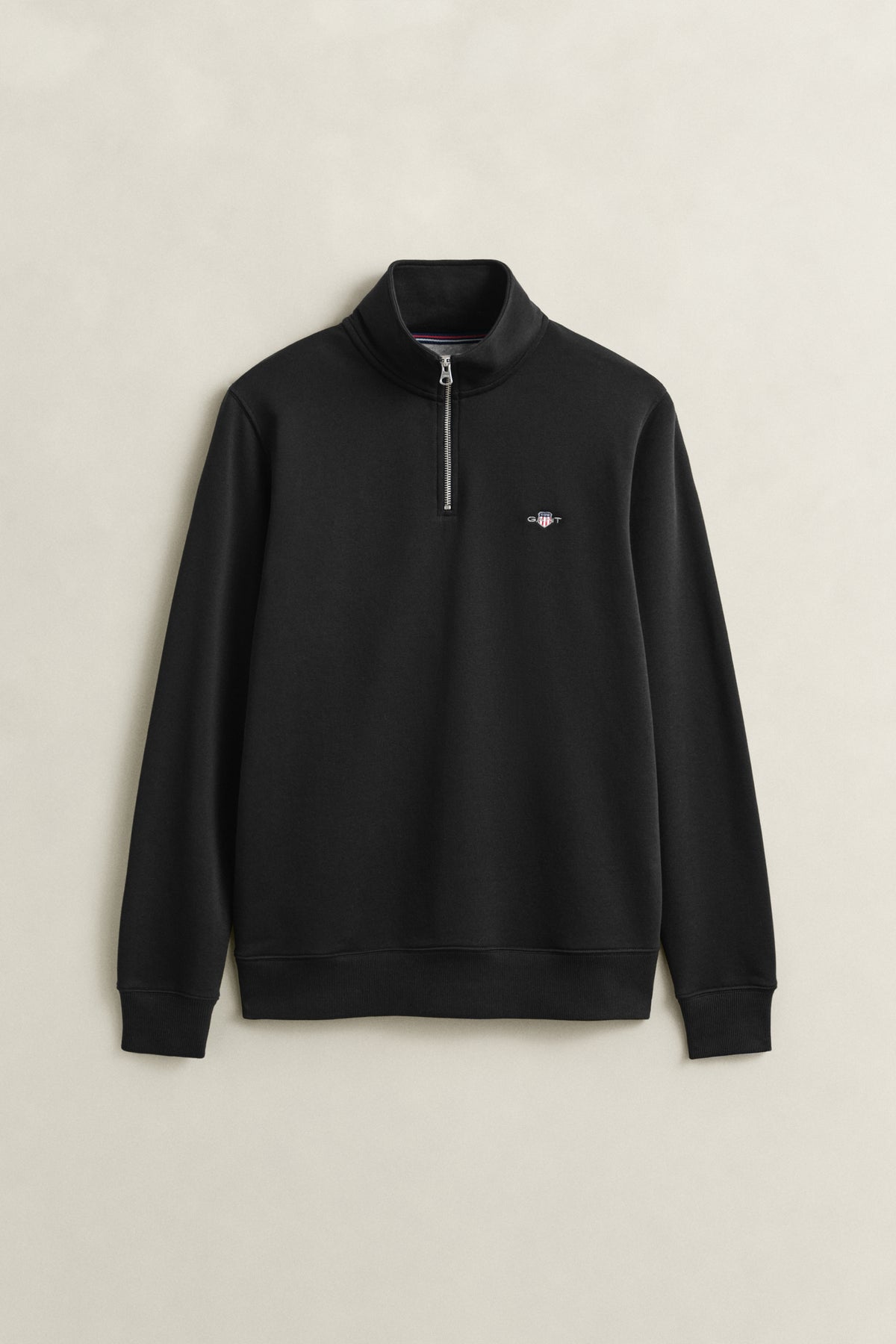 BLACK, REG SHIELD HALF ZIP SWEAT, FLAT-LAY BY GANT AU.