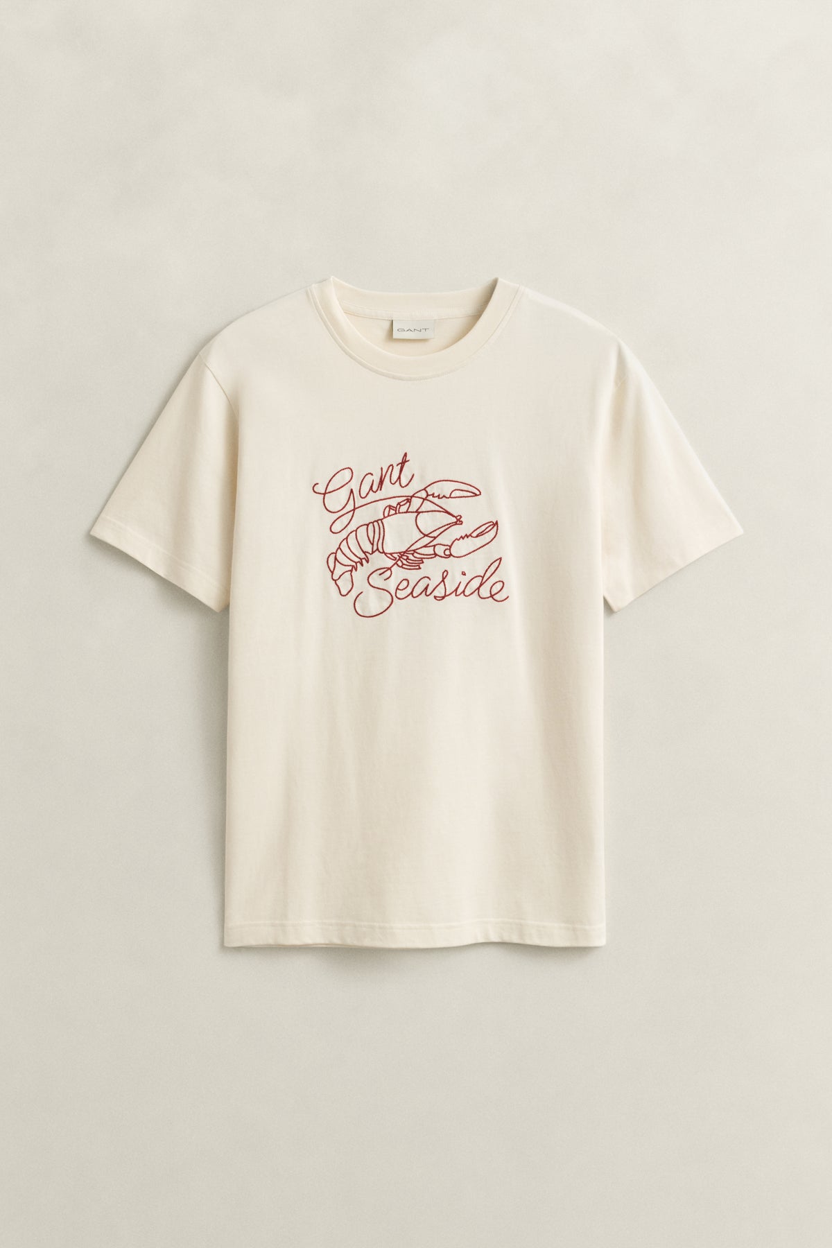 CREAM, EMBROIDERED SS TSHIRT, FLAT-LAY BY GANT AU.