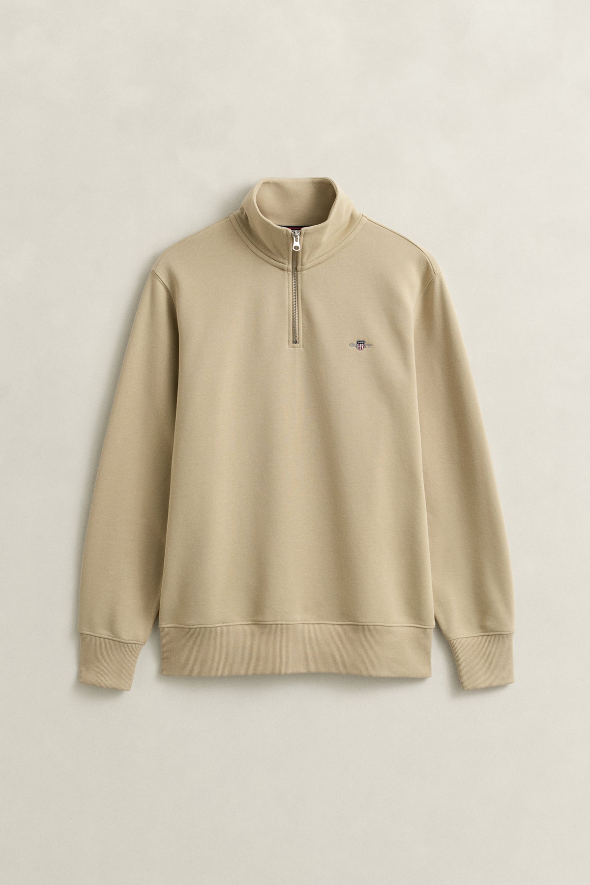OAT BEIGE, REG SHIELD HALF ZIP SWEAT, FLAT-LAY BY GANT AU.