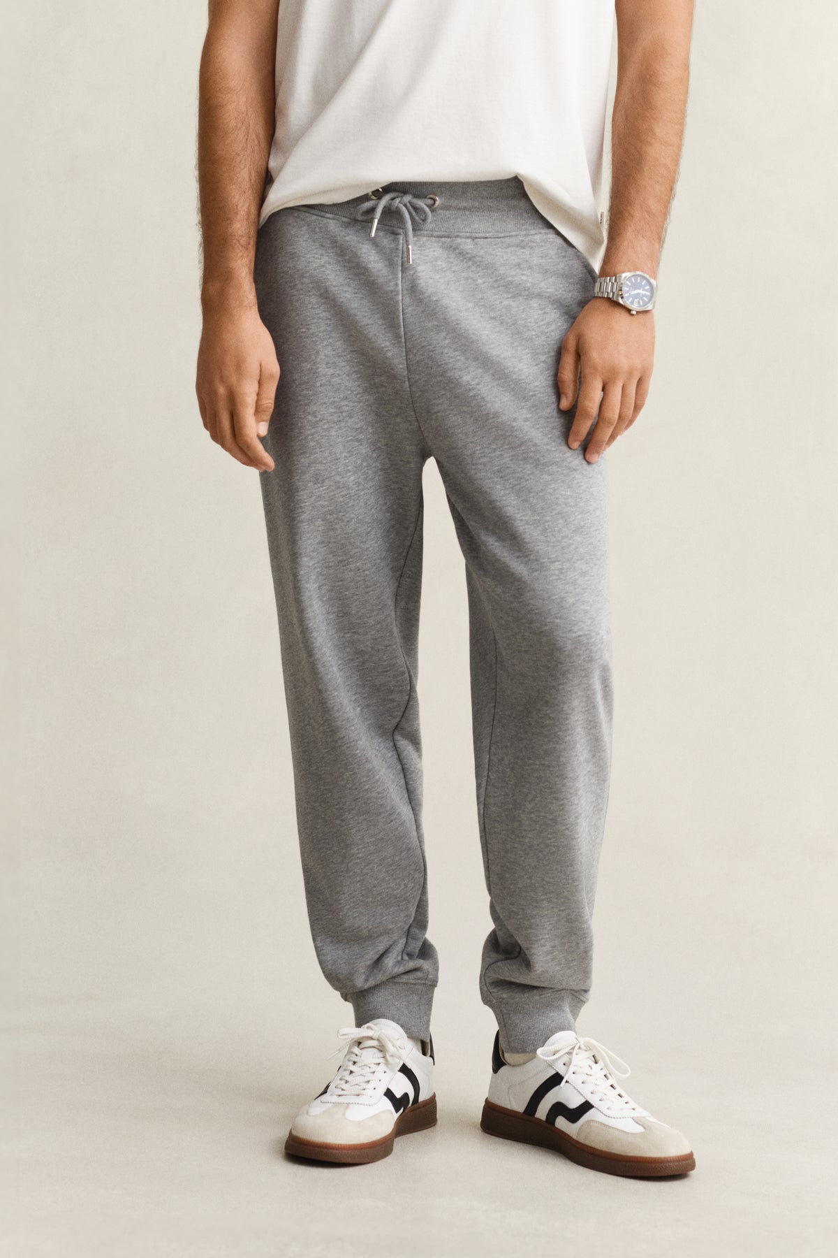 MODEL WEARING REG SHIELD SWEATPANTS
