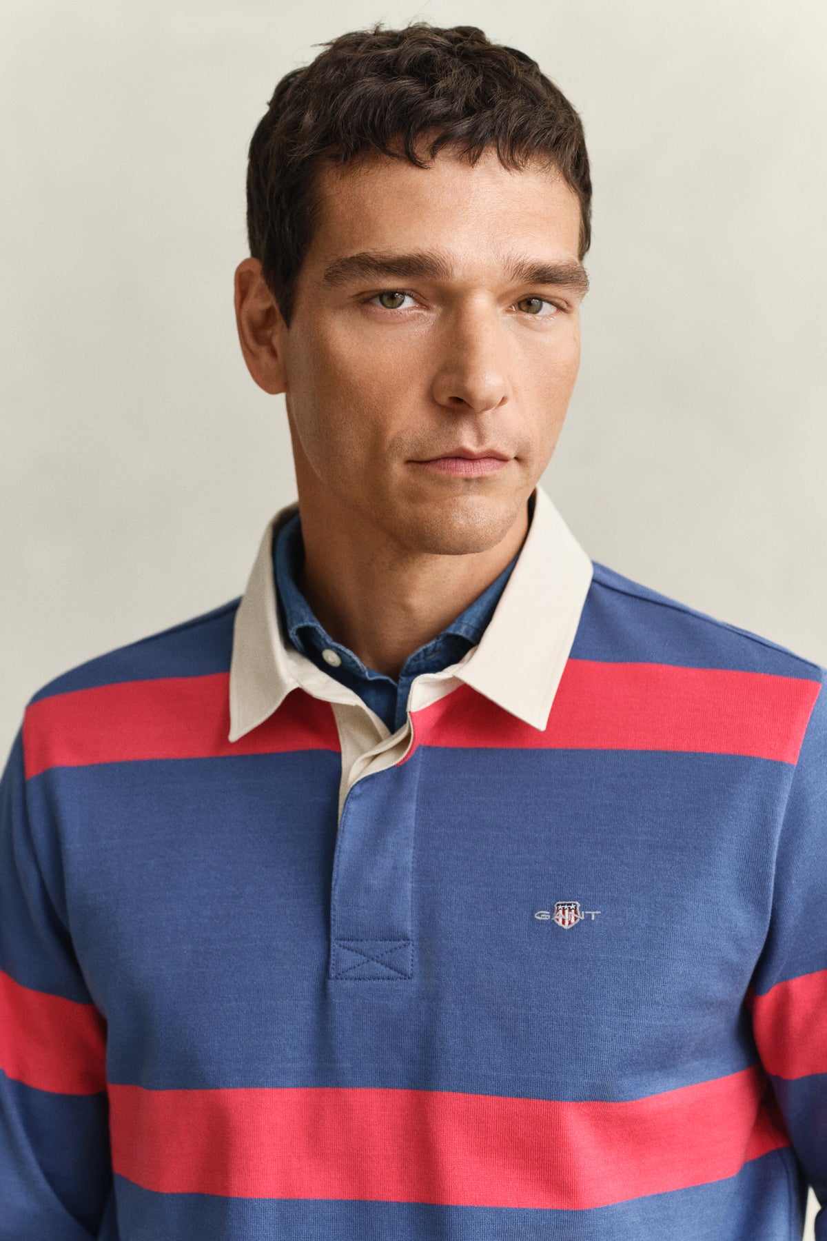 MODEL WEARING STRIPED RUGGER