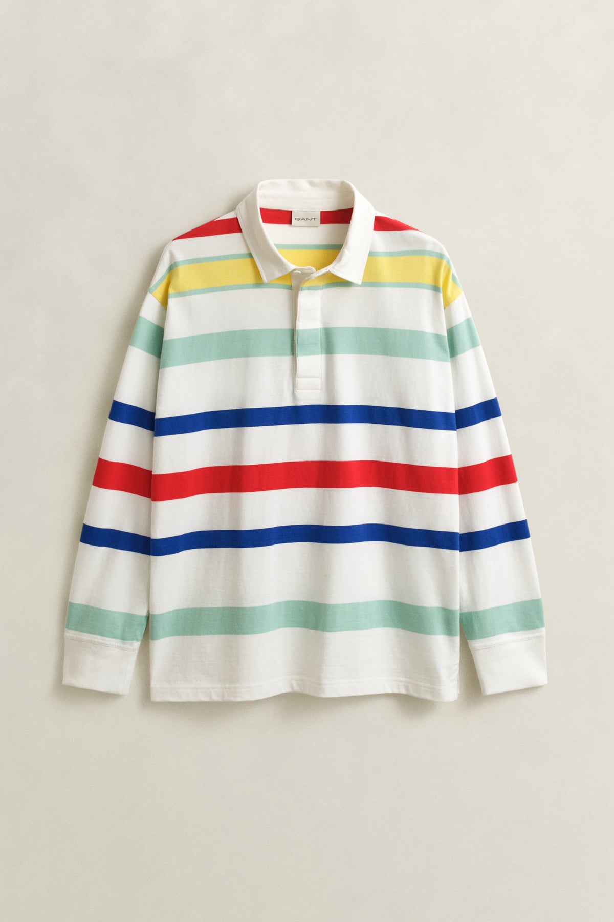 EGGSHELL, MULTI COLOR RUGGER, FLAT-LAY BY GANT AU.