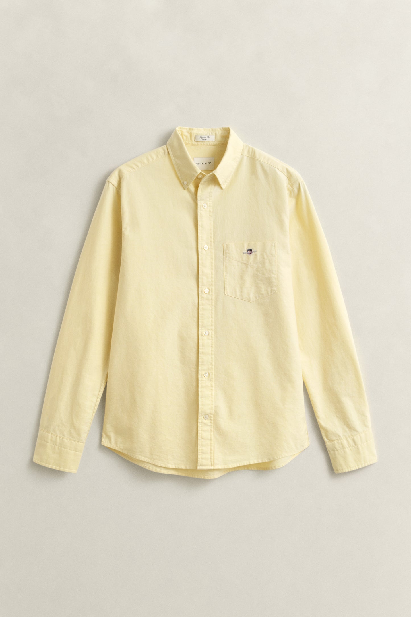 LIGHT MUSTARD YELLOW, REG CLASSIC OXFORD SHIRT, FLAT-LAY BY GANT AU.