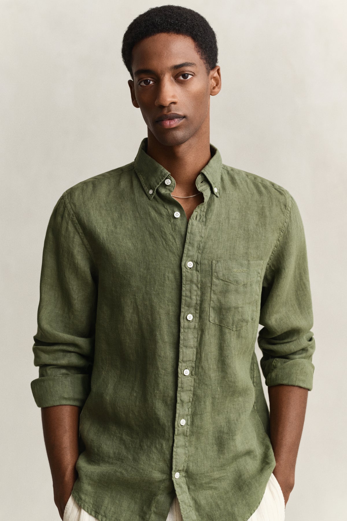 MODEL WEARING REG GMNT DYED LINEN SHIRT
