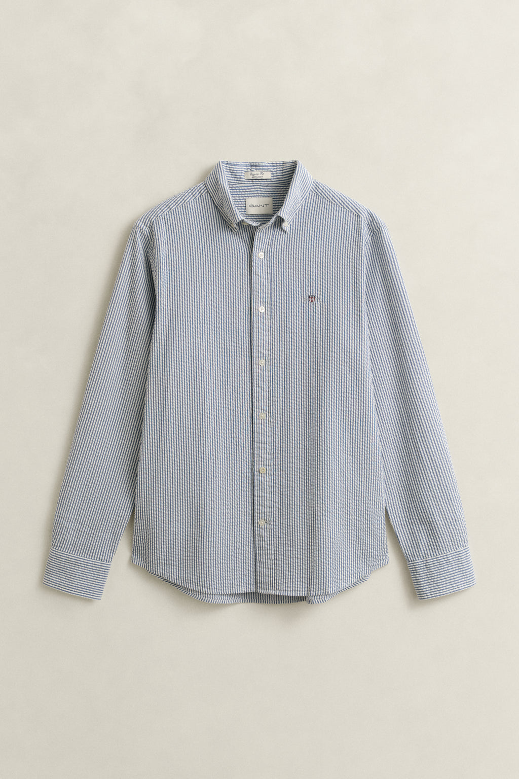 VINTAGE BLUE, REG SEERSUCKER STRIPE SHIRT, FLAT-LAY BY GANT AU.