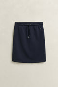 EVENING BLUE, REG SHIELD JERSEY SKIRT, FLAT-LAY BY GANT AU.