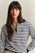 MODEL WEARING STRIPED HALF ZIP SWEAT