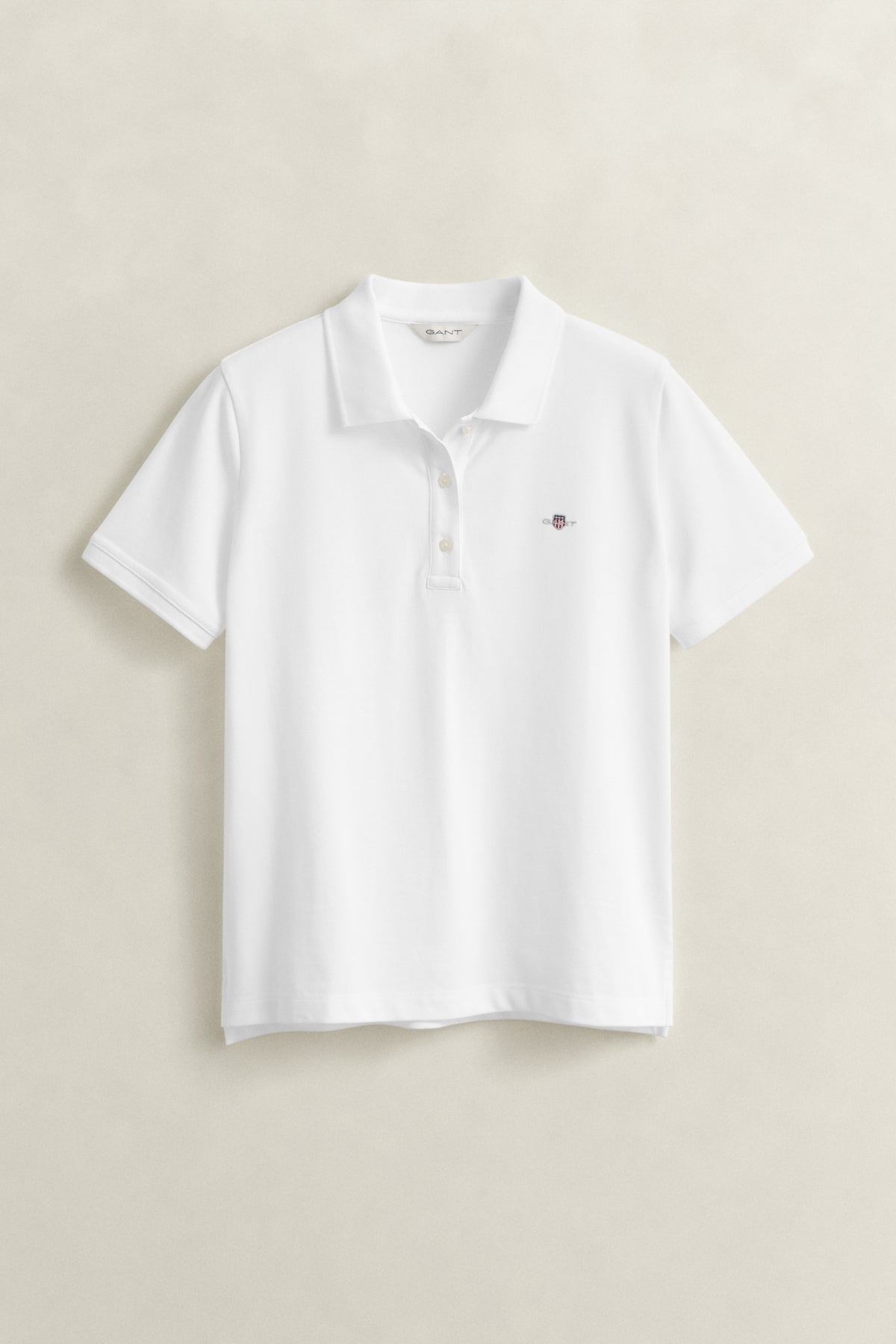 WHITE, REG SHIELD SS PIQUE POLO, FLAT-LAY BY GANT AU.
