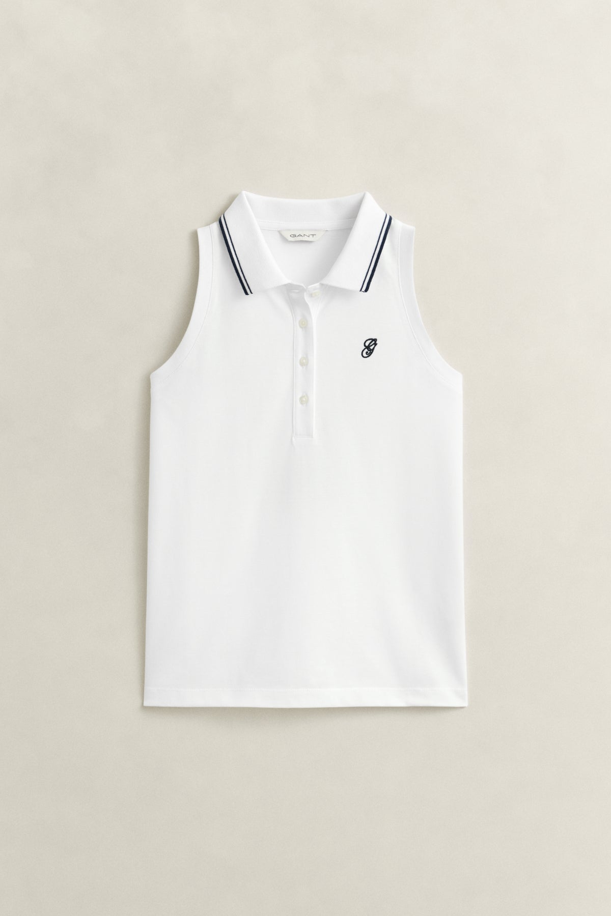 WHITE, REG SLEEVELESS PIQUE POLO, FLAT-LAY BY GANT AU.