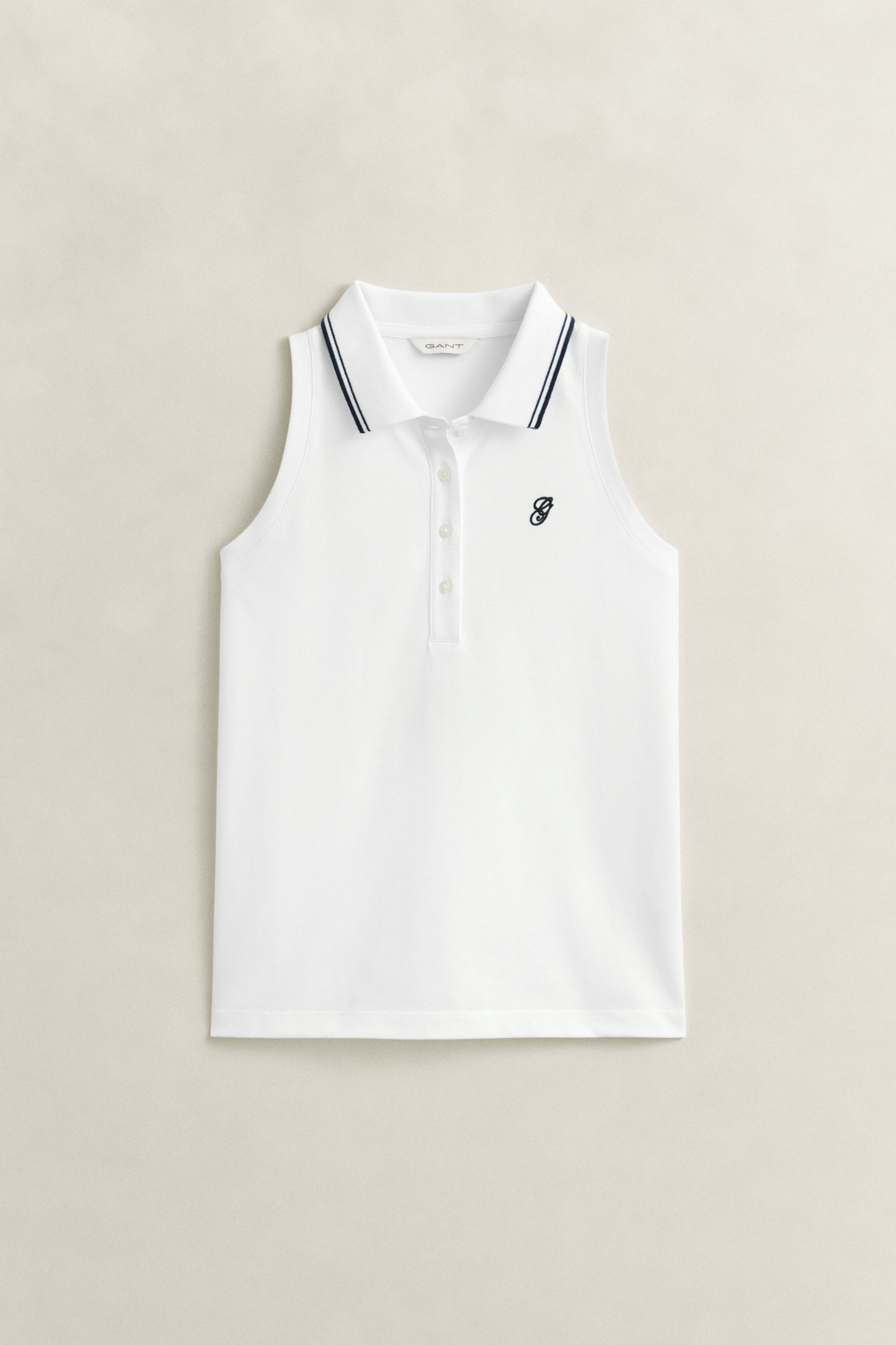 WHITE, REG SLEEVELESS PIQUE POLO, FLAT-LAY BY GANT AU.