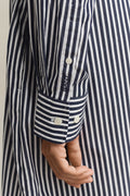MODEL WEARING CLASSIC POPLIN STRIPE SHIRT DRESS