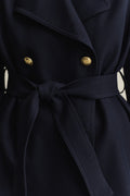 MODEL WEARING FLUID SHORT TRENCH COAT