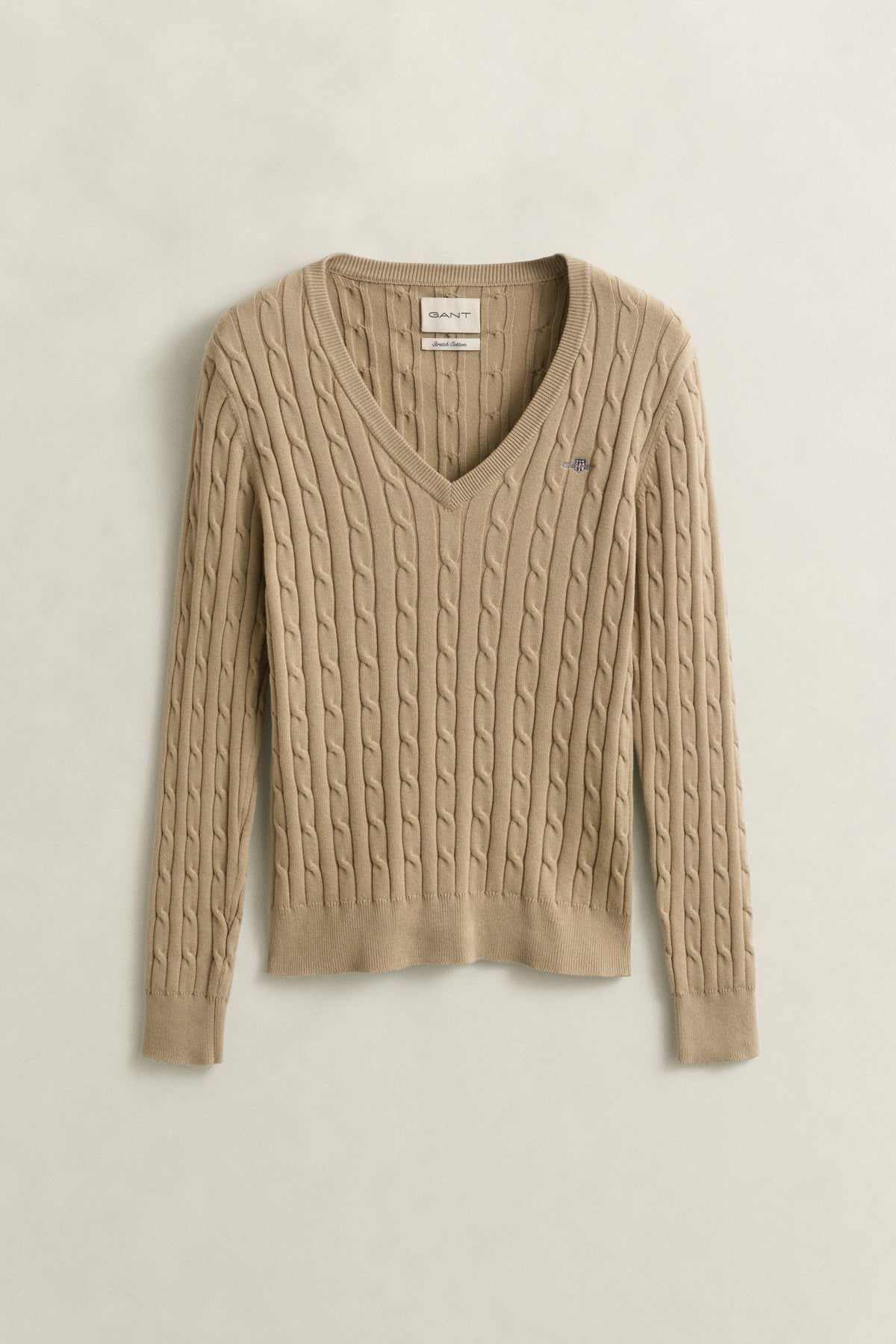 OAT BEIGE, STRETCH COTTON CABLE V-NECK, FLAT-LAY BY GANT AU.