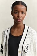 MODEL WEARING GANT VARSITY CABLE CARDIGAN