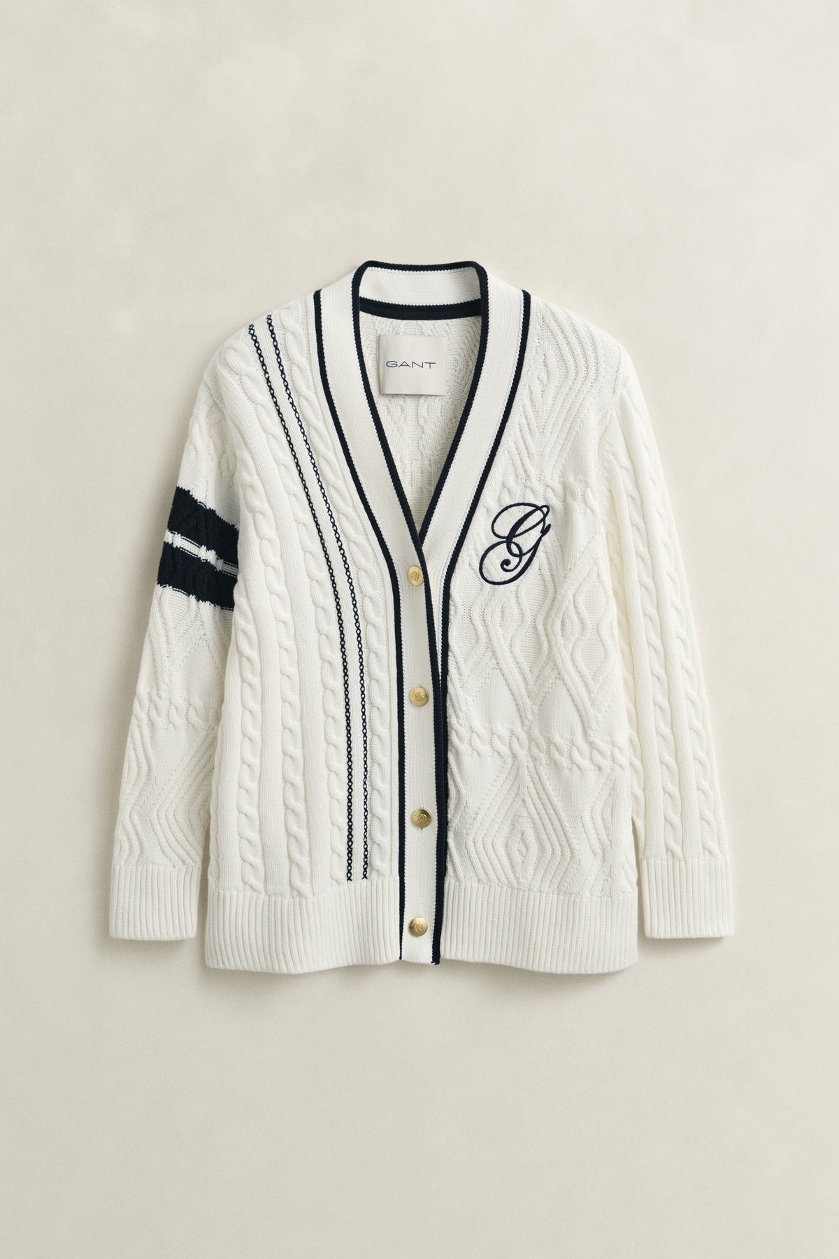 EGGSHELL, GANT VARSITY CABLE CARDIGAN, FLAT-LAY BY GANT AU.