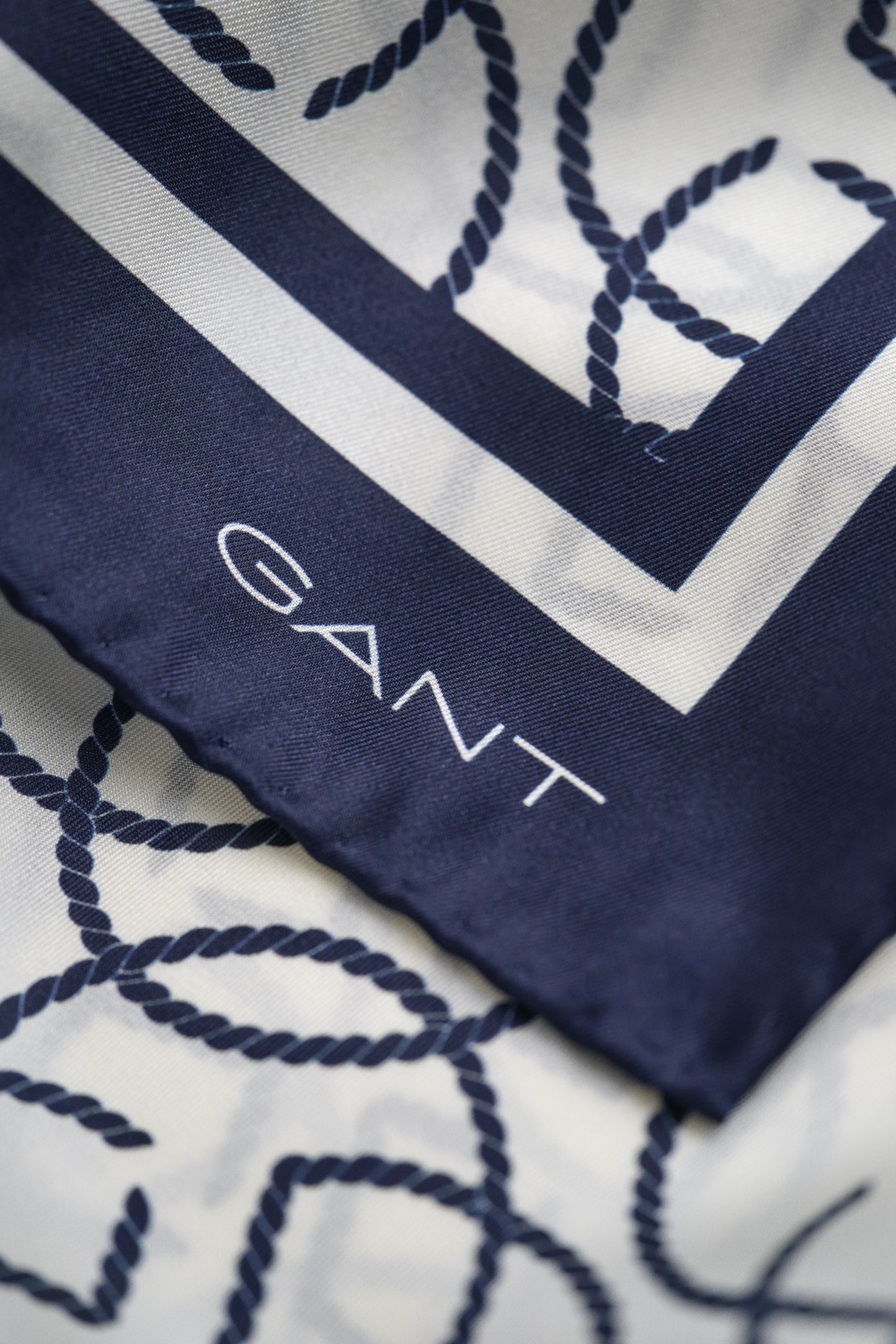 CREAM, MONOGRAM PRINT SILK SCARF, CLOSE-UP BY GANT AU.