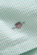 MUTED TURQUOISE, STRIPED SEERSUCKER SWIM SHORTS, FLAT-LAY BY GANT AU.