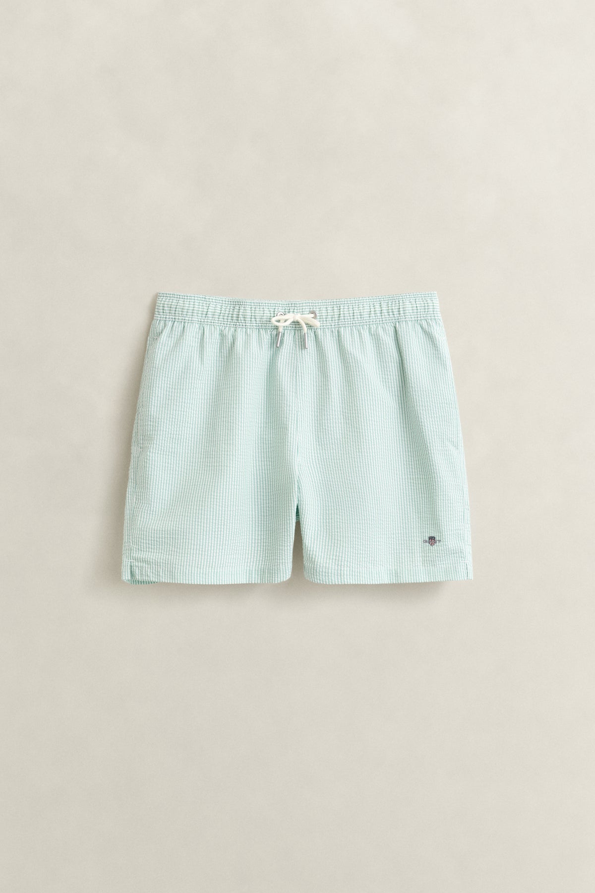MUTED TURQUOISE, STRIPED SEERSUCKER SWIM SHORTS, FRONT-VIEW BY GANT AU.