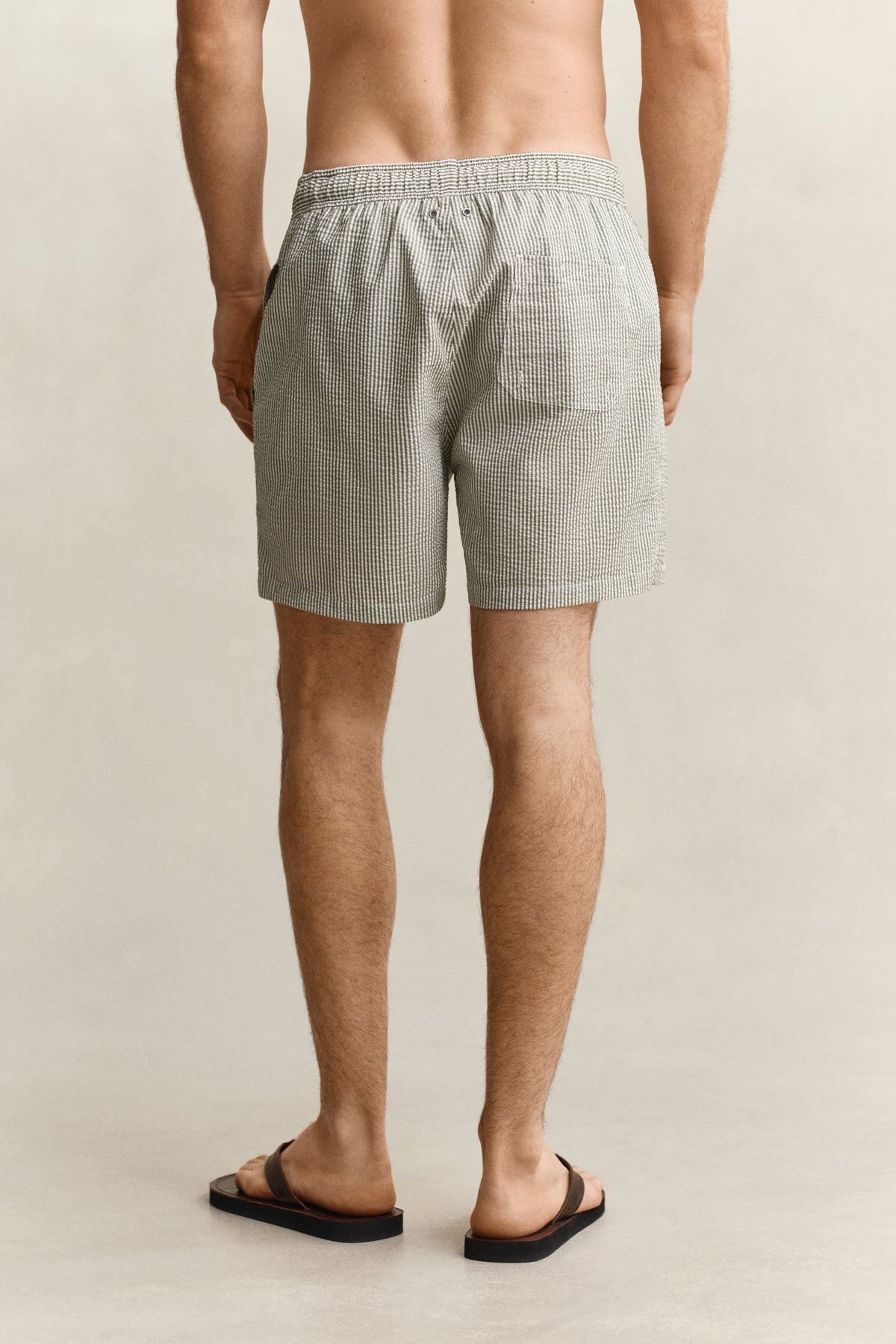 DRY HERB GREEN, STRIPED SEERSUCKER SWIM SHORTS, BACK-VIEW BY GANT AU.