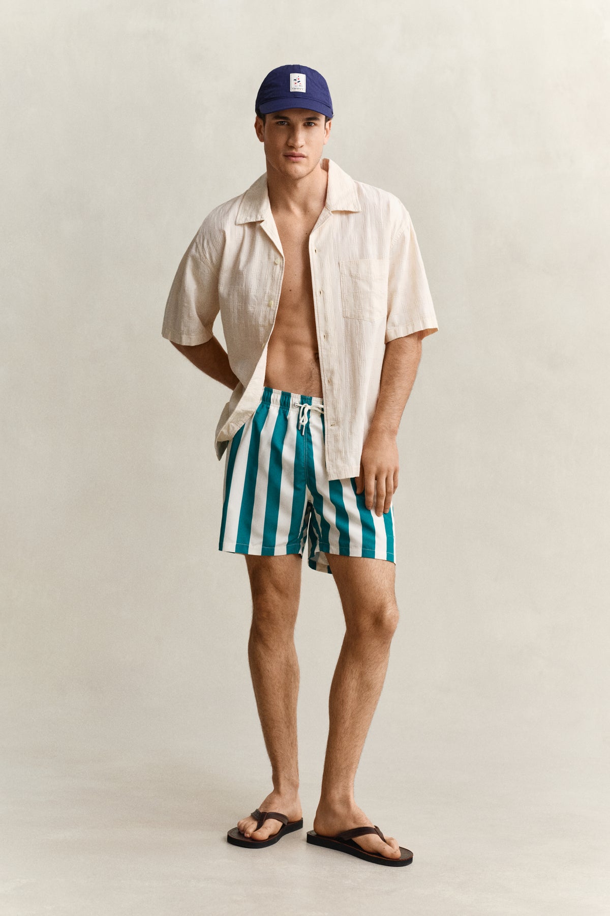 AQUA BLUE, BLOCK STRIPED SWIM SHORTS BY GANT AU.
