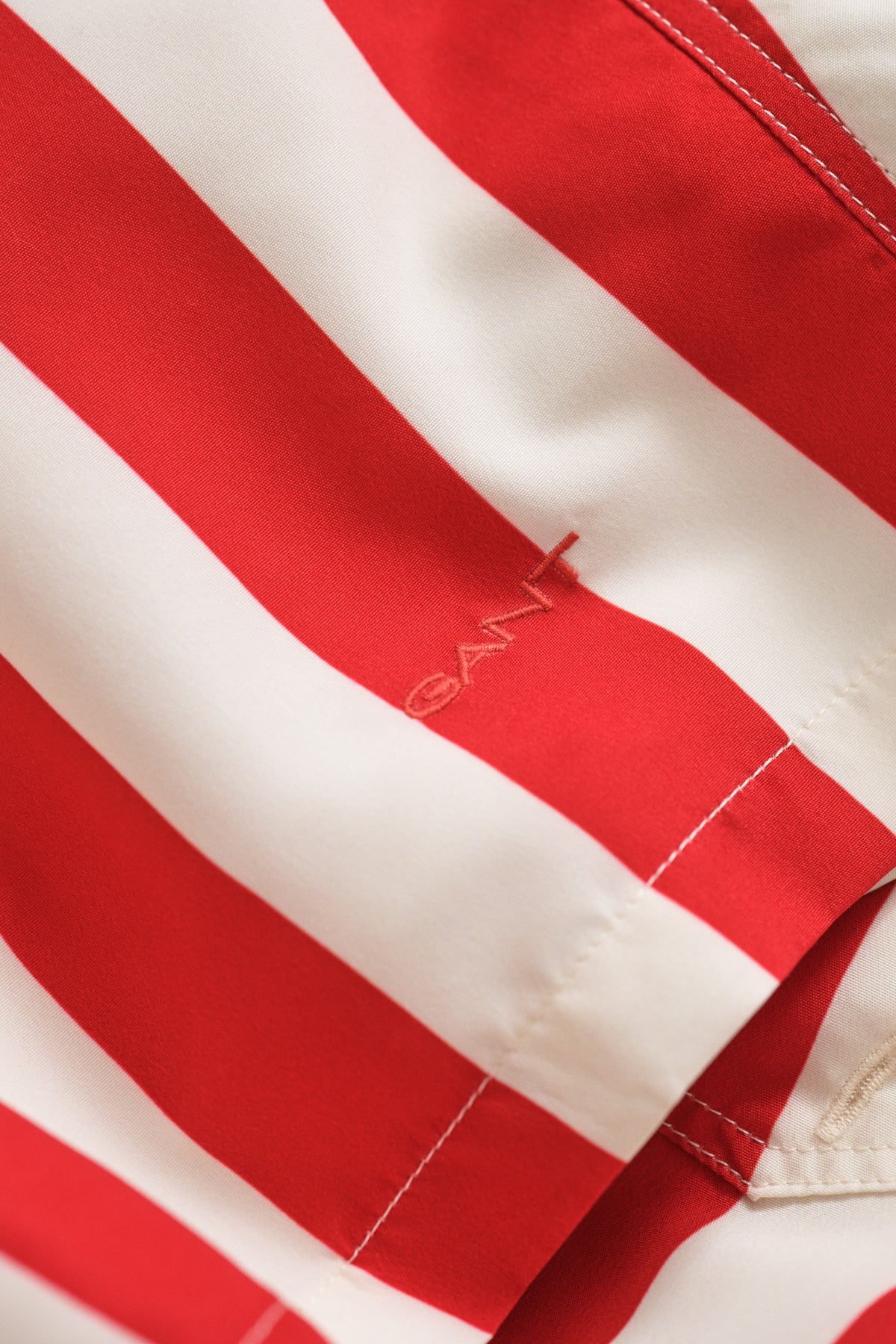 ROSE RED, BLOCK STRIPED SWIM SHORTS, FLAT-LAY BY GANT AU.
