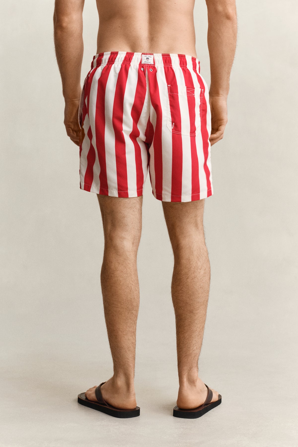 ROSE RED, BLOCK STRIPED SWIM SHORTS, BACK-VIEW BY GANT AU.