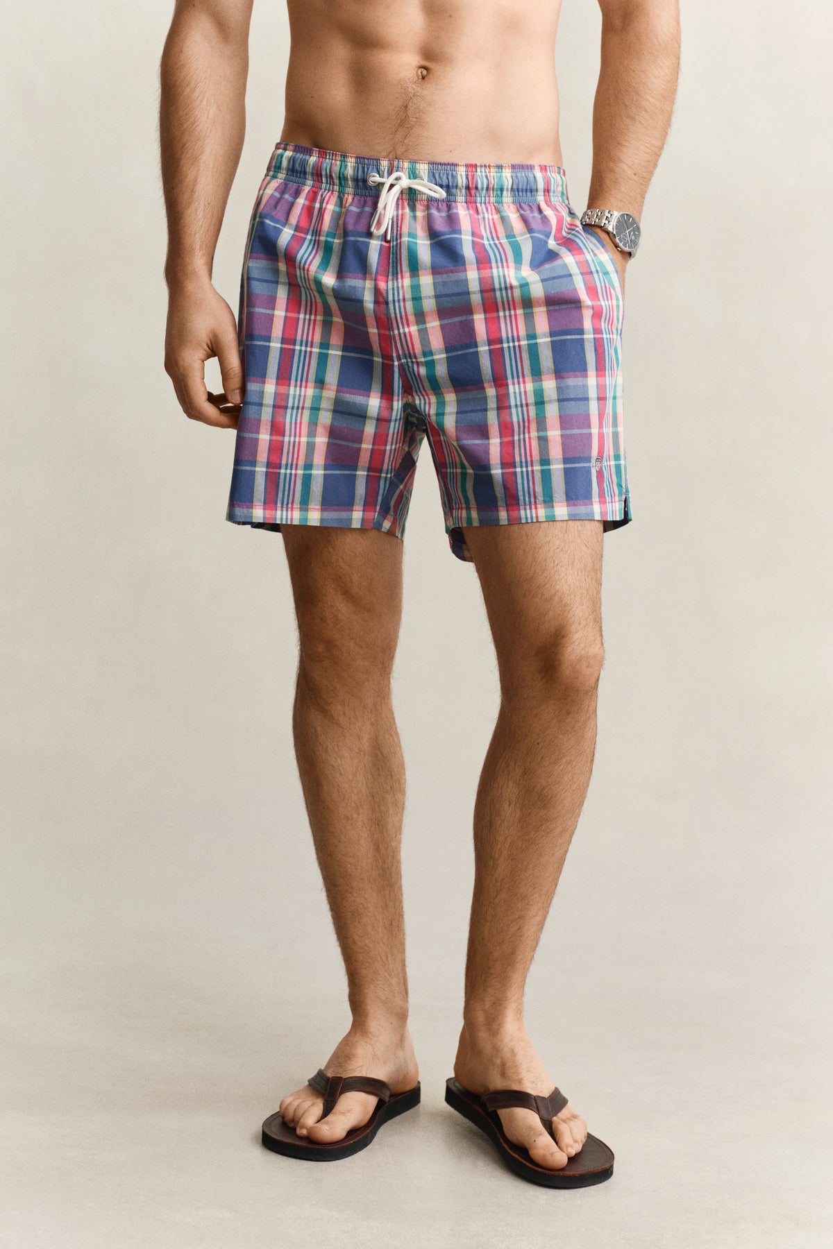 MODEL WEARING MADRAS CHECK SWIM SHORTS