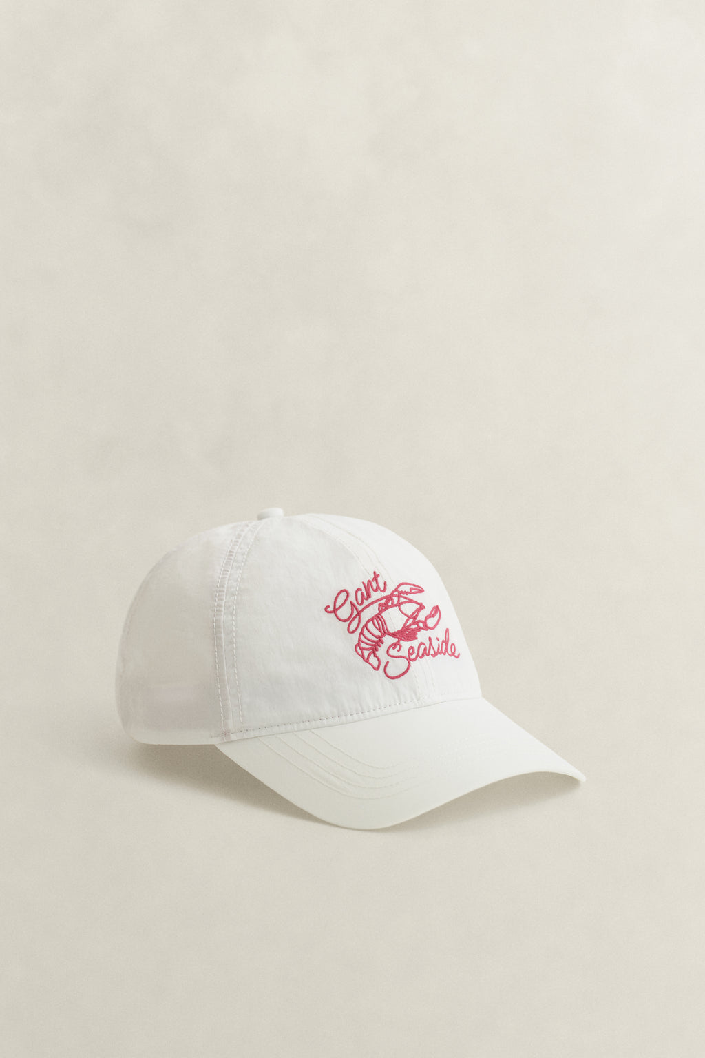 CREAM, GRAPHIC CRINKLED CAP, FRONT-VIEW BY GANT AU.