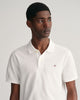 MODEL WEARING REG SHIELD SS PIQUE POLO