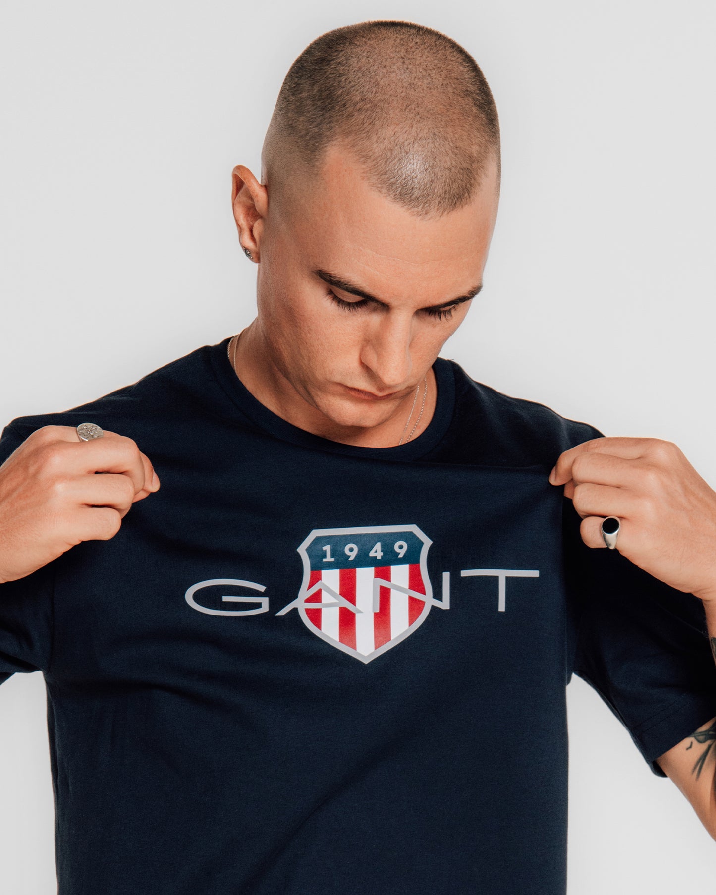 MODEL WEARING REG ARCHIVE SHIELD TSHIRT